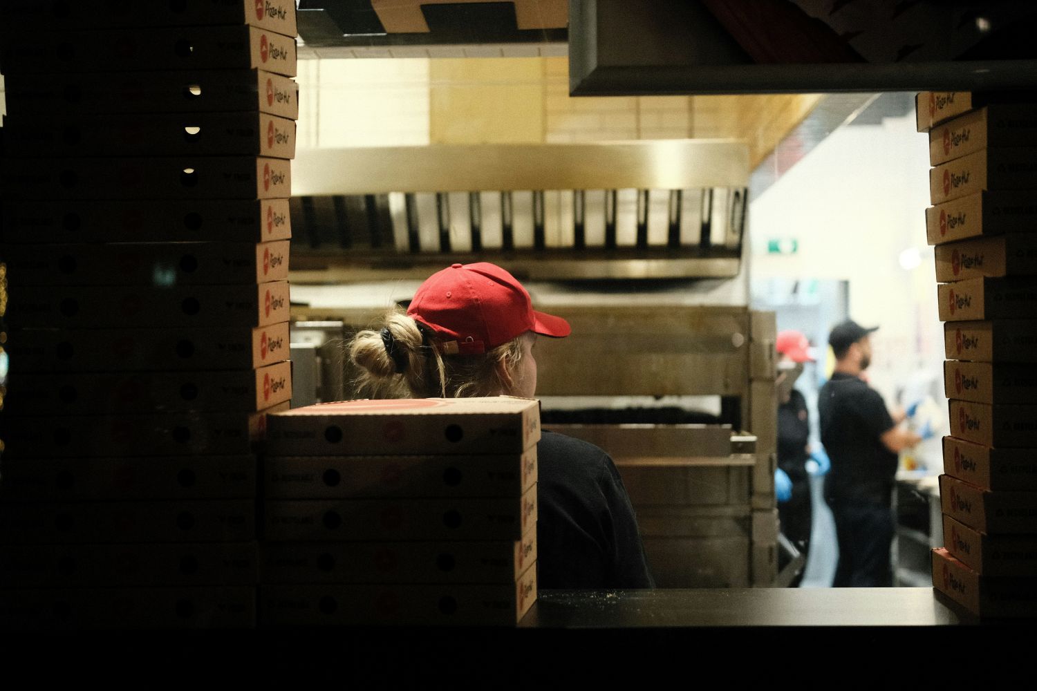 QSR workers in a busy kitchen