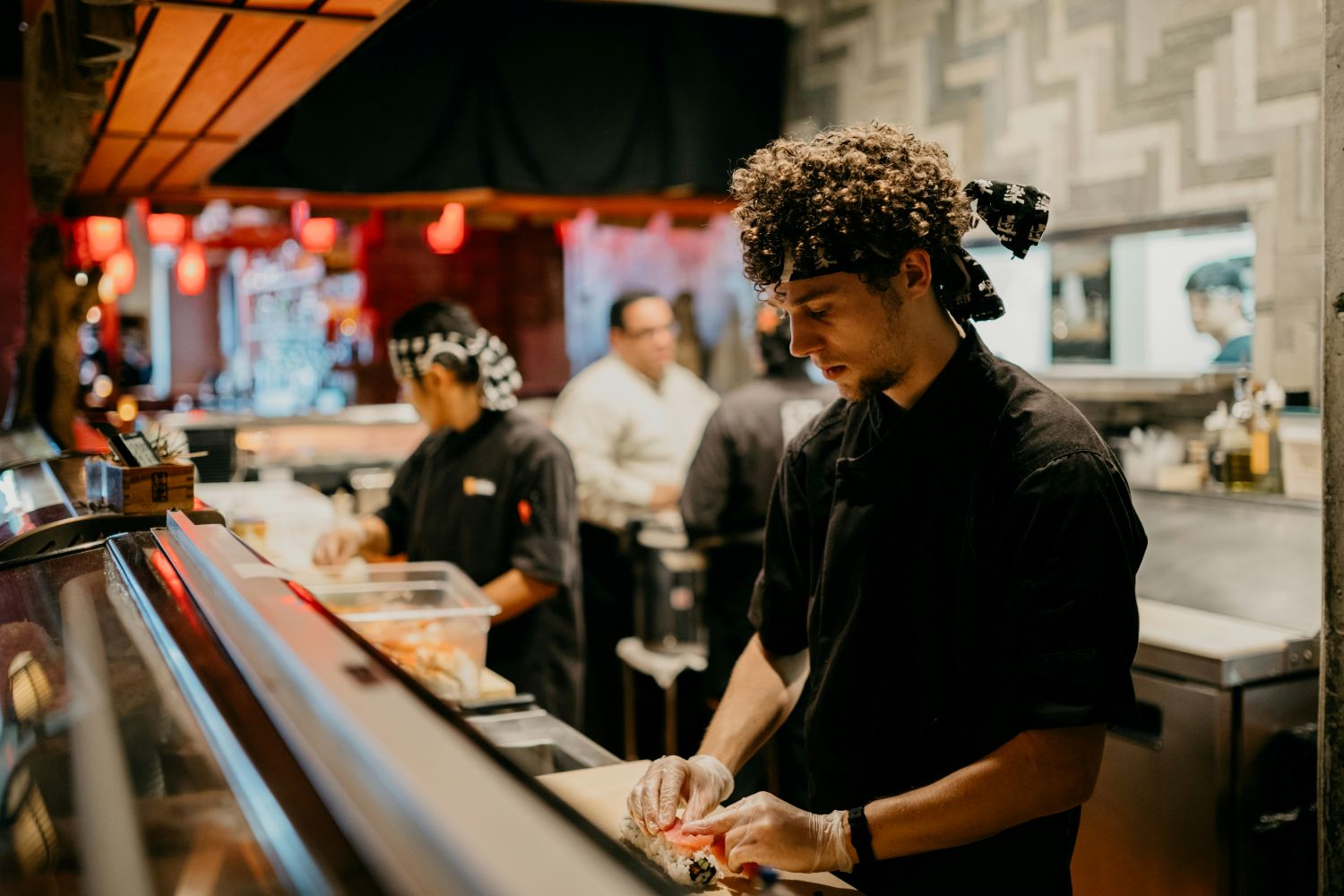 Restaurant worker preparing sushi